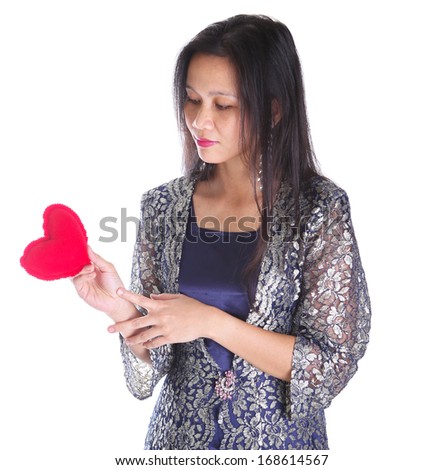 Adult female with a Valentine heart shape object over white background