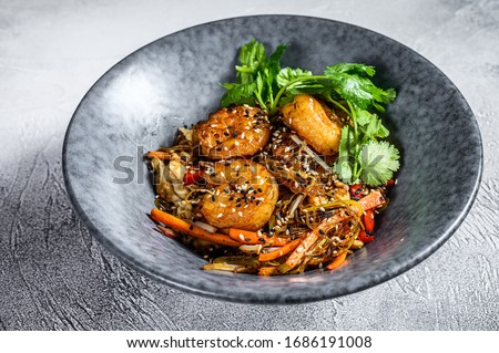 Singapore Mei Fun. Rice noodles with shrimps, prawns, char siu pork, carrot, onion, napa cabbage. White background. Top view Royalty-Free Stock Photo #1686191008