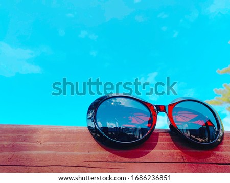 This is a picture of sunglasses and the sky.