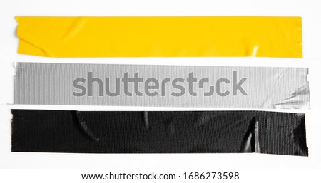 Set of yellow, gray, black tapes on white background. Torn horizontal and different size sticky tape, adhesive pieces. Royalty-Free Stock Photo #1686273598