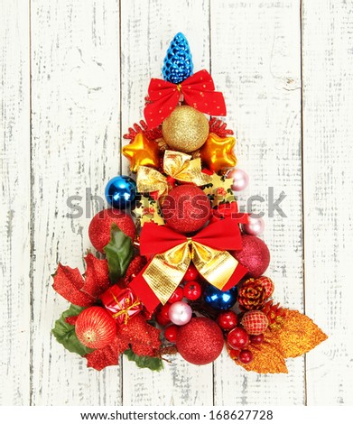 Christmas tree of Christmas toys on wooden table close-up