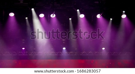 stage light with colored spotlights and smoke, concert scene 