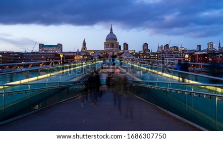 Long exposure at dusk of Millenium Bridge in London with St Pauls in background