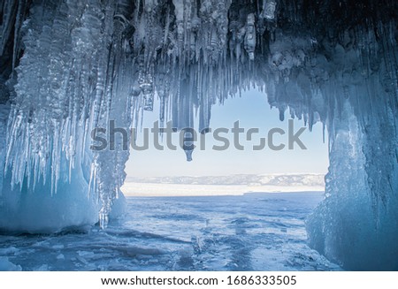 Ice cave on Olkhon island on Baikal lake in Siberia at winter time Royalty-Free Stock Photo #1686333505