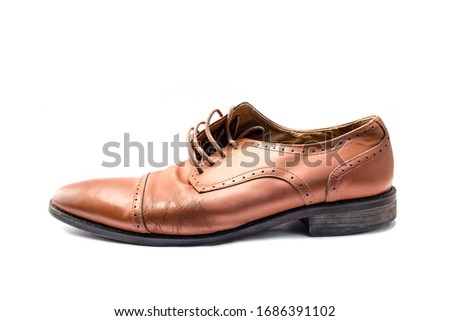 Men's brown leather shoes isolated on white background.
