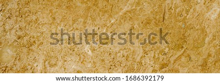 golden wall texture abstract background, Yellow glittering stone walls texture background, metalic abstract luxurious gold texture exposed aggregate in seamless patterns on concrete wall background.