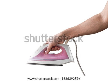 Hand holding electric iron, Isolated on white background with clipping path.