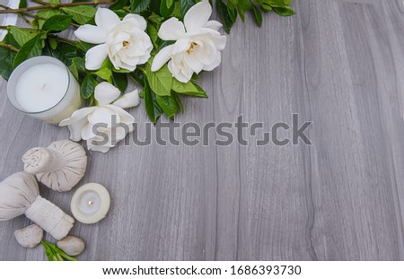 spa setting and Spa composition with white gardenia flower on wooden background 

