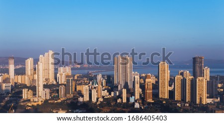 The rising skyline of Mumbai's eastern seafront- the cityscape of Parel, Bhoiwada, Sewri, Kalachowie and Lalbaug dotted by a mix of complete and under construction residential skyscrapers. Royalty-Free Stock Photo #1686405403