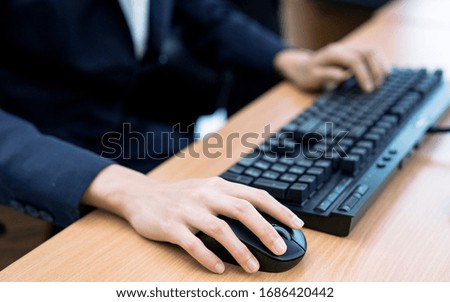 Close-up pictures of businesswomen working through Internet.
