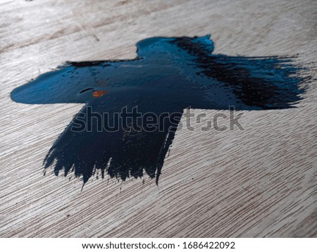 Use a black paint brush on plywood.