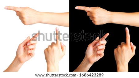 Set of woman hands with the index finger pointing on side on black background. Isolated with clipping path.