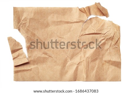 Torn crumpled beige paper sheet isolated on white background