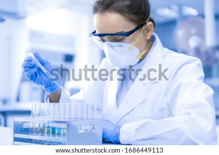 Young female scientist working in the CDC laboratory. Royalty-Free Stock Photo #1686449113