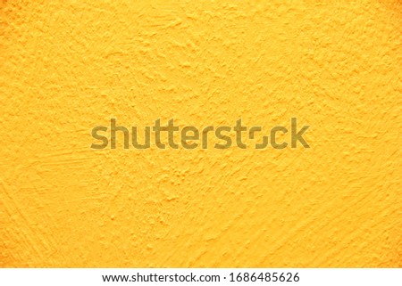 Yellow wall texture. Bright warm yellow wall background
