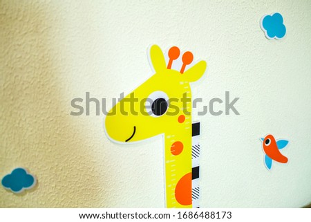 cartoon giraffe on kindergarten wall
