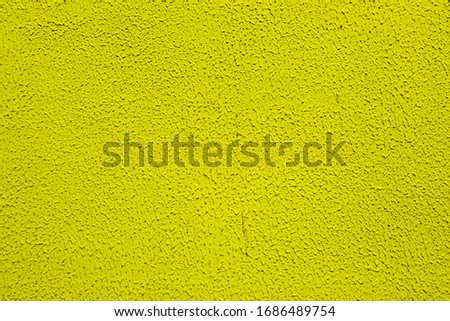 Yellow rough concrete wall. Yellow concrete wall background