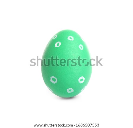 Green egg for Easter celebration isolated on white