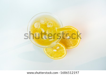 Fresh lemon soda drink iced with lemon sliced on white background Top view.
