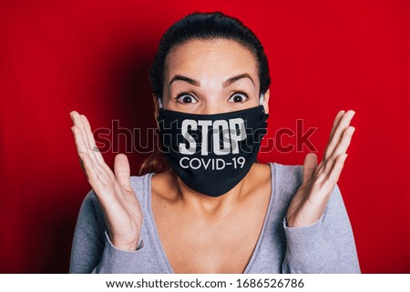 Woman wearing a black mask worried about the coronavirus pandemic.