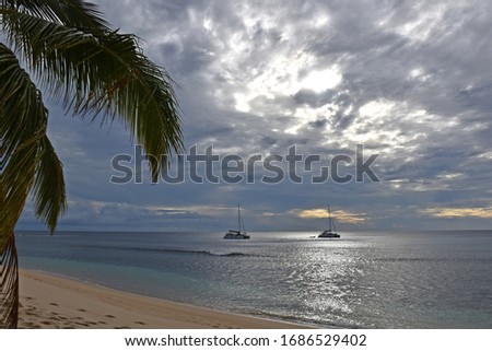 Cloudescape at tropical beach on Waya island, Fiji