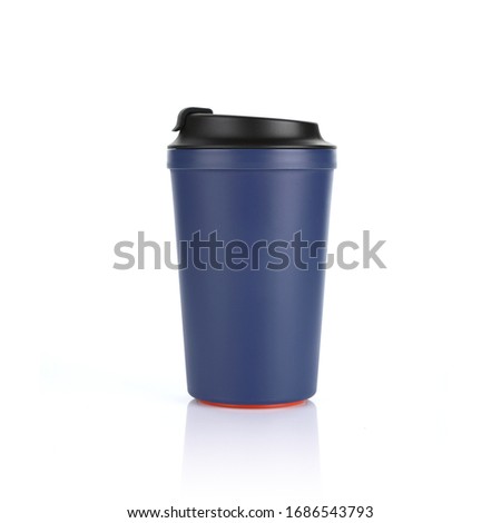 Classic blue colour anti slip suction coffee mug isolated on white background. Front view with reflection. Suitable for hot & cold beverage. For branding, mock up and advertisement. Royalty-Free Stock Photo #1686543793