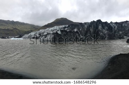 Gray nature landscape picture about cold water and mountains