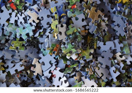 Puzzle pieces, garden picture and blue back