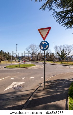 Roundabout and yield signs in the street