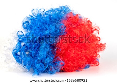 Multi-colored clown wig Isolated on a white background. The concept of humor, performance