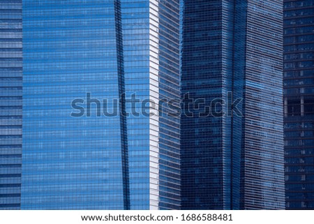 High glass skyscrapers on the streets of Singapore. Office windows background, close up