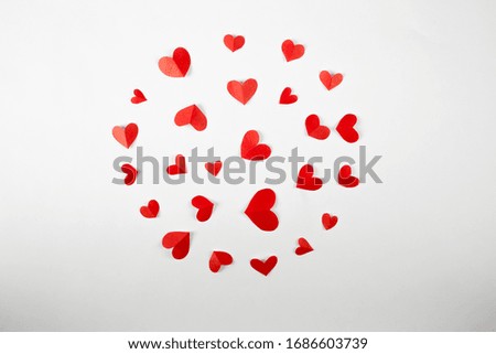 A pattern of red hearts on a white background