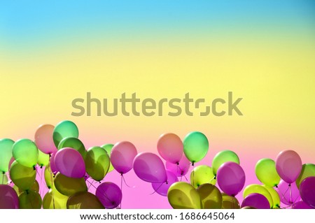 Colorful balloons in the sky stock images. Multicolored inflatable balloons frame stock images. Party balloons background with copy space for text. Rainbow balloons stock images