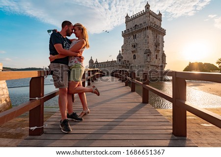 Couple in love on a small bridge leading to tower of Belem in Lisbon Royalty-Free Stock Photo #1686651367