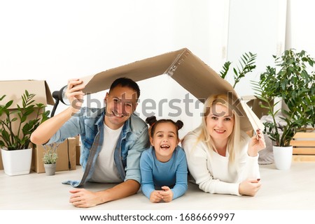 Stay Home Safe Campaign. A happy european family remained at quarantine self-isolation. Pandemic coronavirus covid 19 responsibility conscious decision. Royalty-Free Stock Photo #1686669997