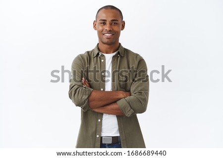 Business, people and lifestyle concept. Portrait of handsome african american man cross hands on chest and smiling pleased, own small shop, manage store with help of employees, white background