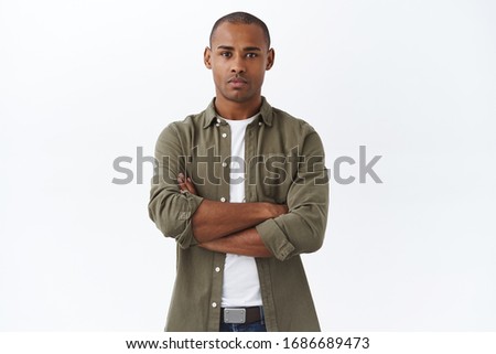 Young serious-looking, confident african american male employee, cross hands chest, waiting for appointment, apply for job position, look determined, standing white background Royalty-Free Stock Photo #1686689473
