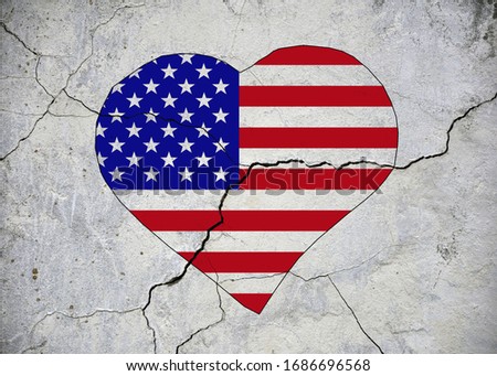 USA flag in the shape of a heart on an old flaccid wall. crack.