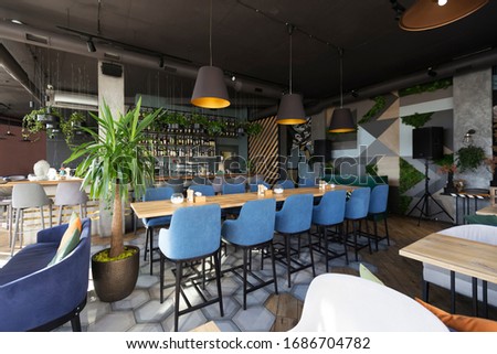 Bar counter with alcohol bottles assortment. Barroom in restaurant, hotel, pub copy space. Cafe background Royalty-Free Stock Photo #1686704782
