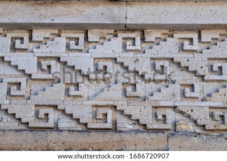 Zapotec geometric design stone fretwork (called grecas in Spanish) in the friezes at Mitla archeological site, Oaxaca, Mexico Royalty-Free Stock Photo #1686720907