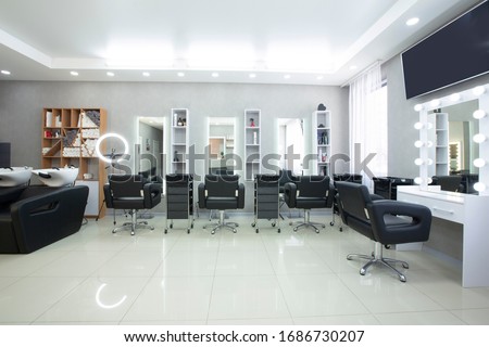 Hairdressing procedures in luxe beauty salon, panorama, free space Royalty-Free Stock Photo #1686730207
