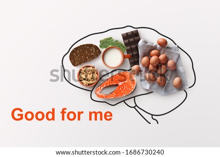 Products to boost your memory. Nutritious foods and outline of brains on white background, creative design Royalty-Free Stock Photo #1686730240