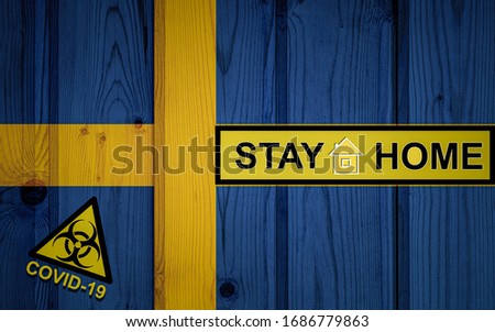 Flag of the Sweden in original proportions. Quarantine and isolation - Stay at home. flag with biohazard symbol and inscription COVID-19.