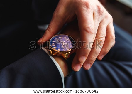 Premium watches on a man hand Royalty-Free Stock Photo #1686790642