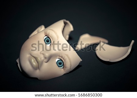 Broken head of the doll, abstract Royalty-Free Stock Photo #1686850300