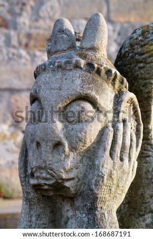 Stone Gargoyle at the medieval castle ruin Giechburg. Travel Picture was taken on a winter morning