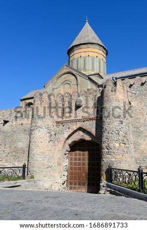 Vertical photo of Svetitskhoveli Cathedral from outside the wall gate. Orthodox Christian church located in Mtskheta, Georgia in the Caucasus. Listed by UNESCO as a World Heritage Site.
