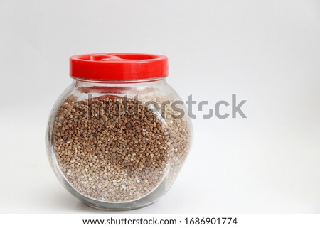 buckwheat in a jar isolated on a white background