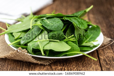 Portion of fresh Spinach as detailed close-up shot (selective focus)