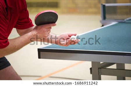 table tennis player doing a serve, close-up Royalty-Free Stock Photo #1686911242